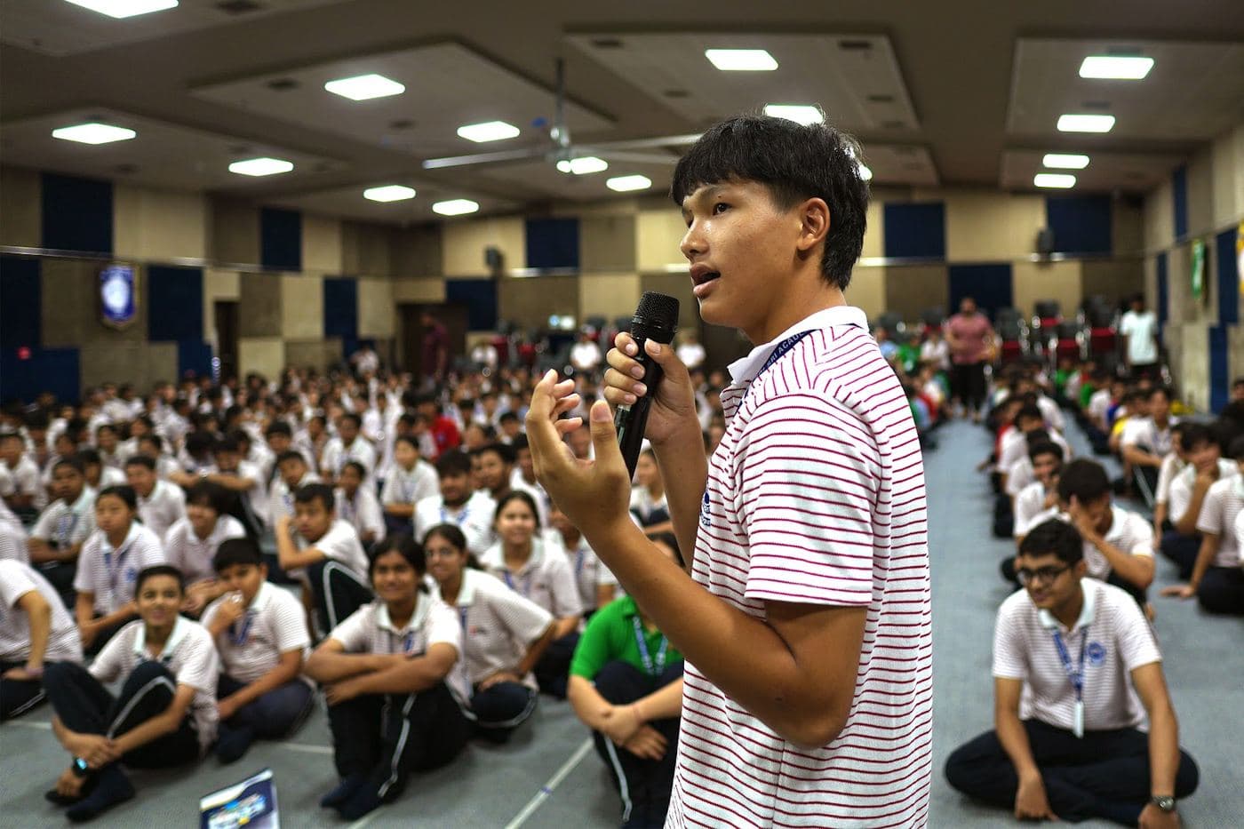 A student puts a question to the speaker