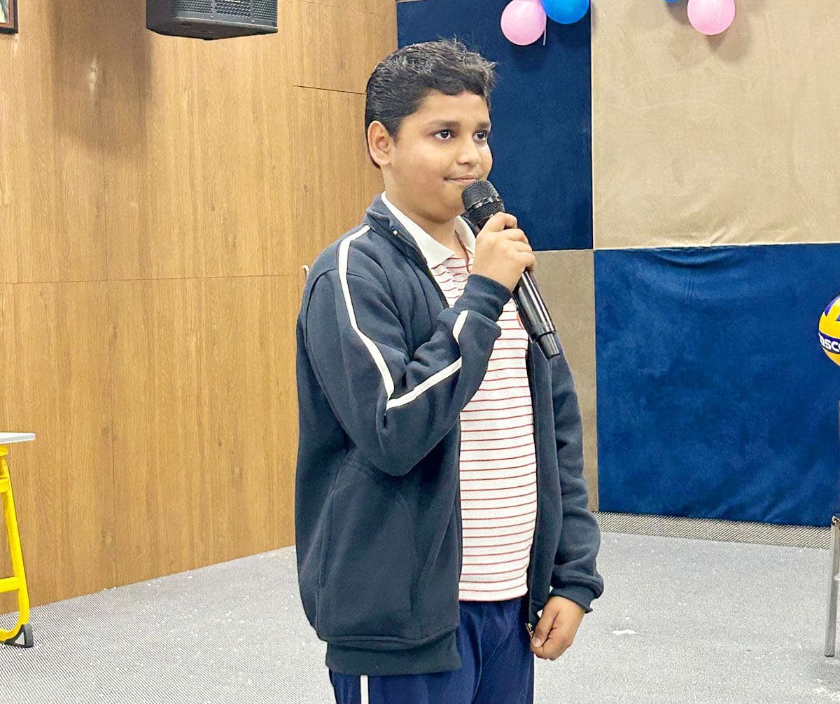 A speaker takes the microphone