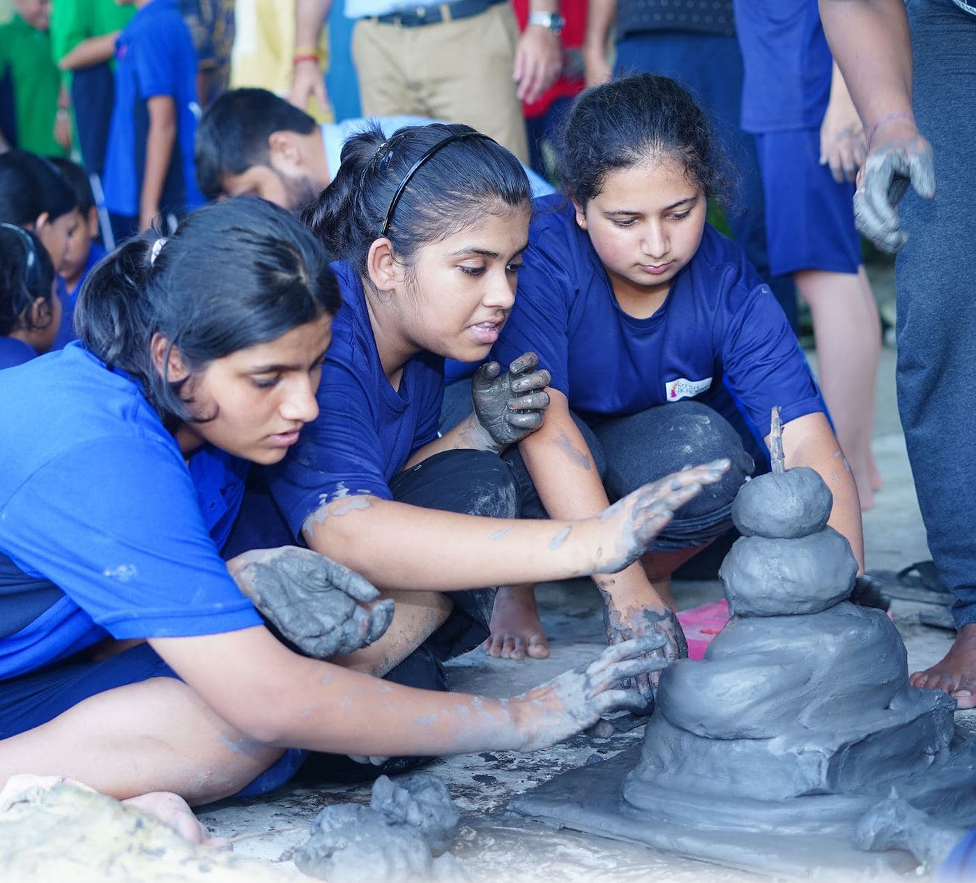 Shaping a pot at the wheel