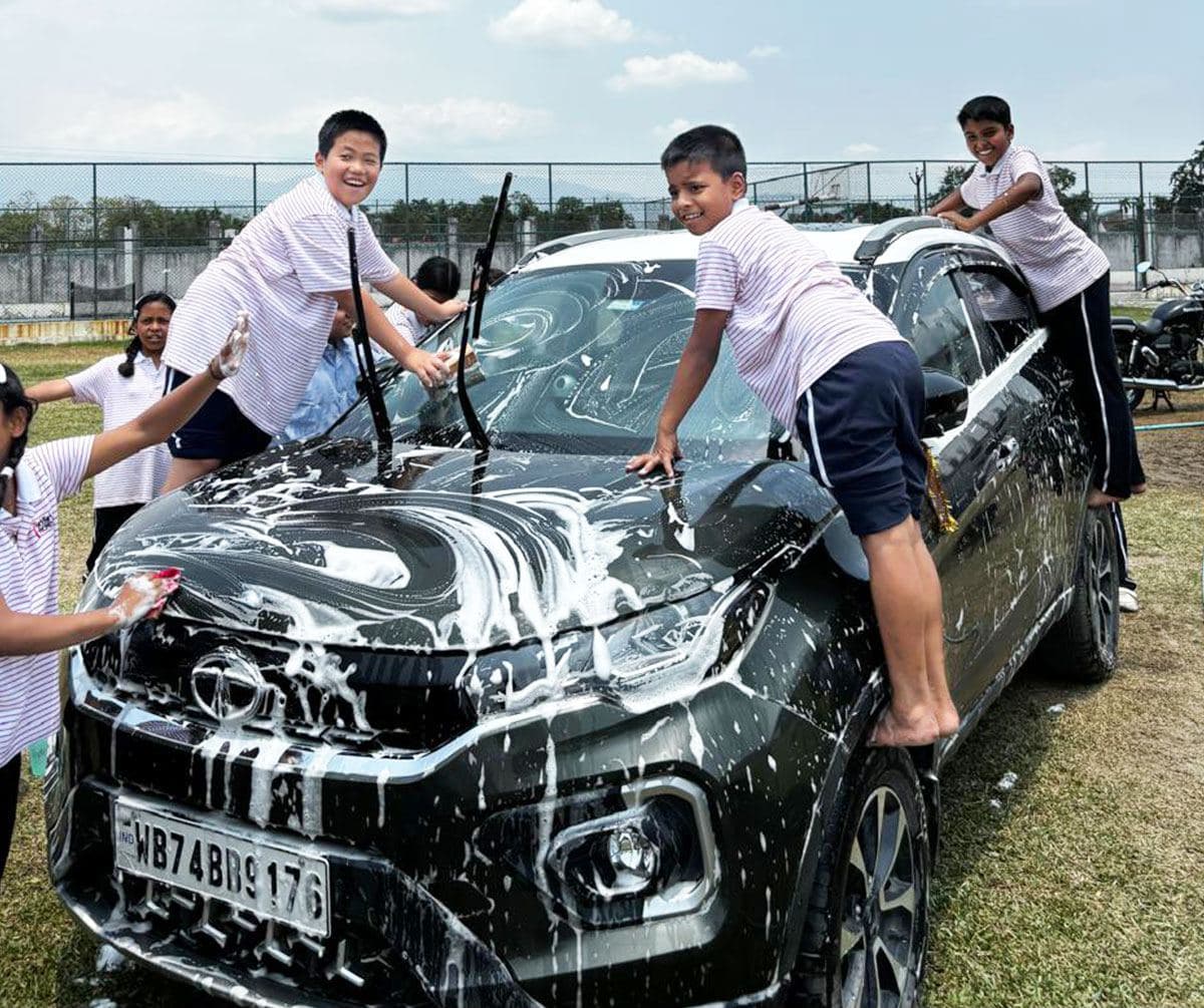 Washing down the car, top to bottom