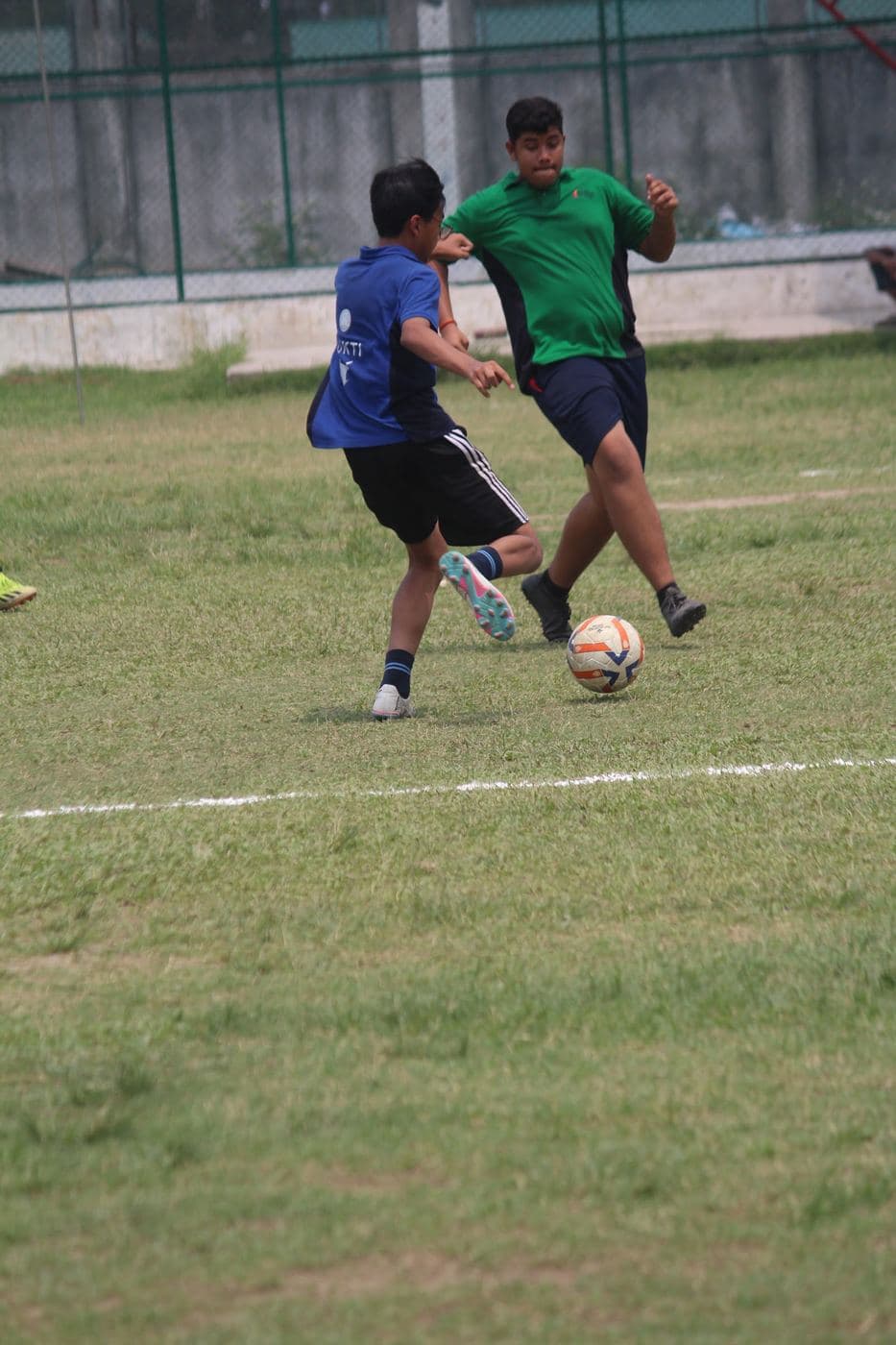 Football on the wet ground
