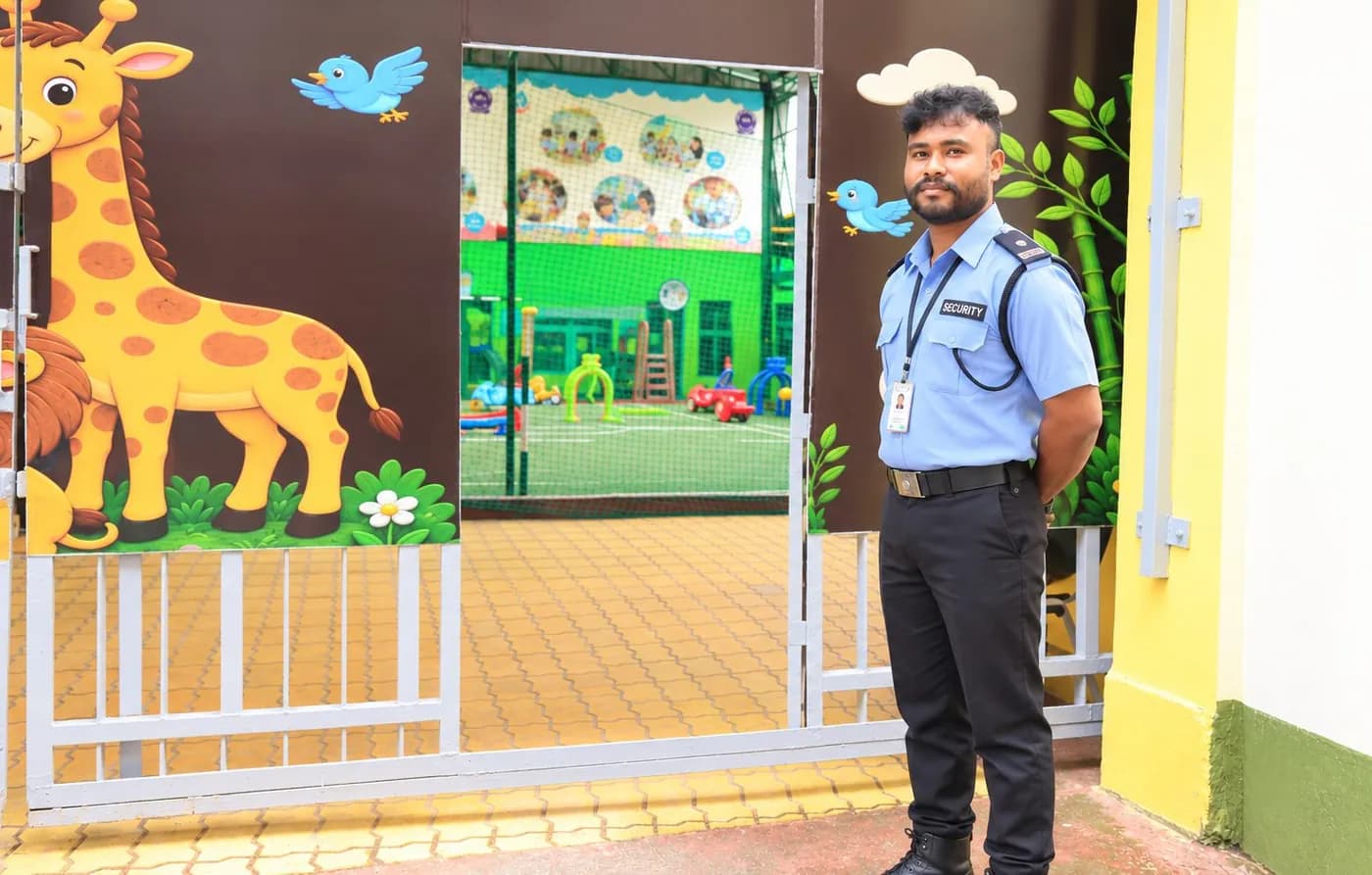 A security guard at the supervised entrance gate of the junior campus