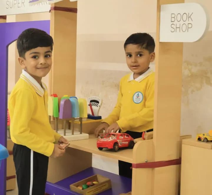 Two children running a pretend book shop