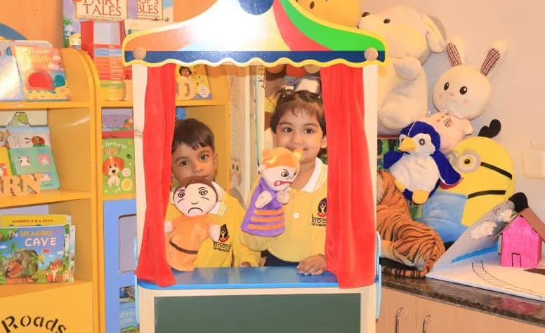 Children performing with hand puppets