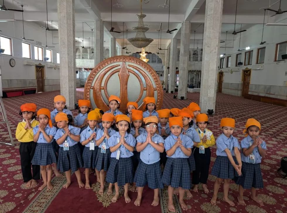 Children with folded hands during a visit to a place of worship