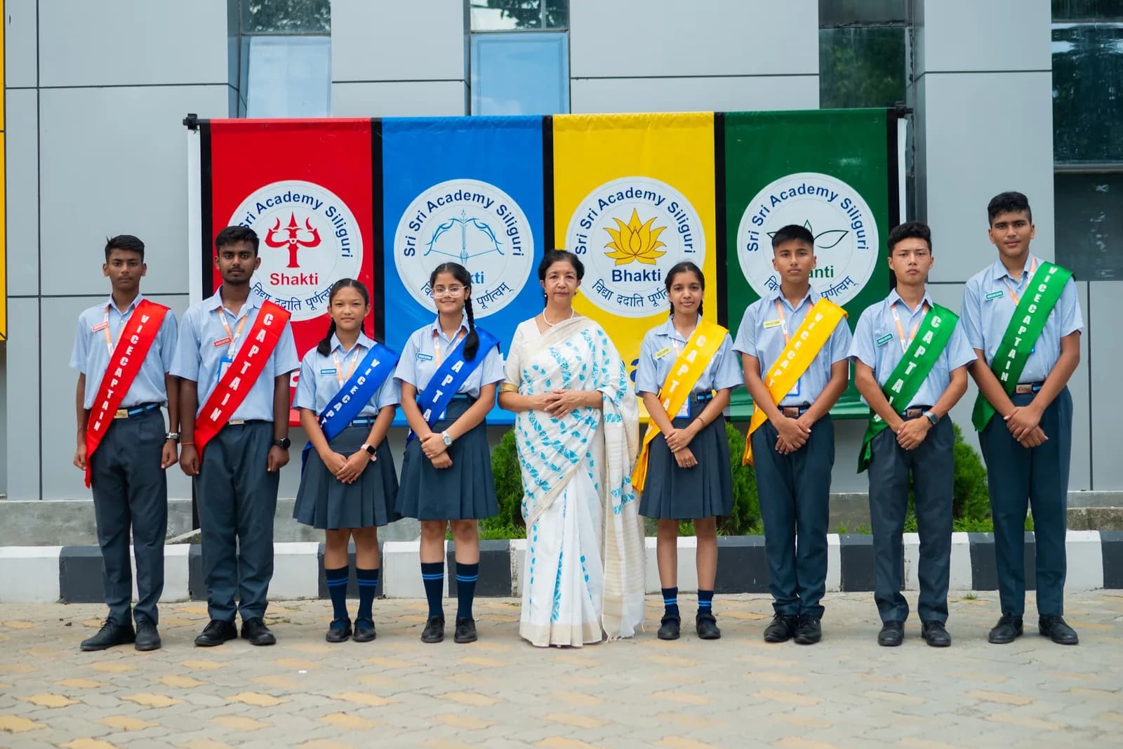 House captains and vice-captains with their house banners at Sri Sri Academy Siliguri