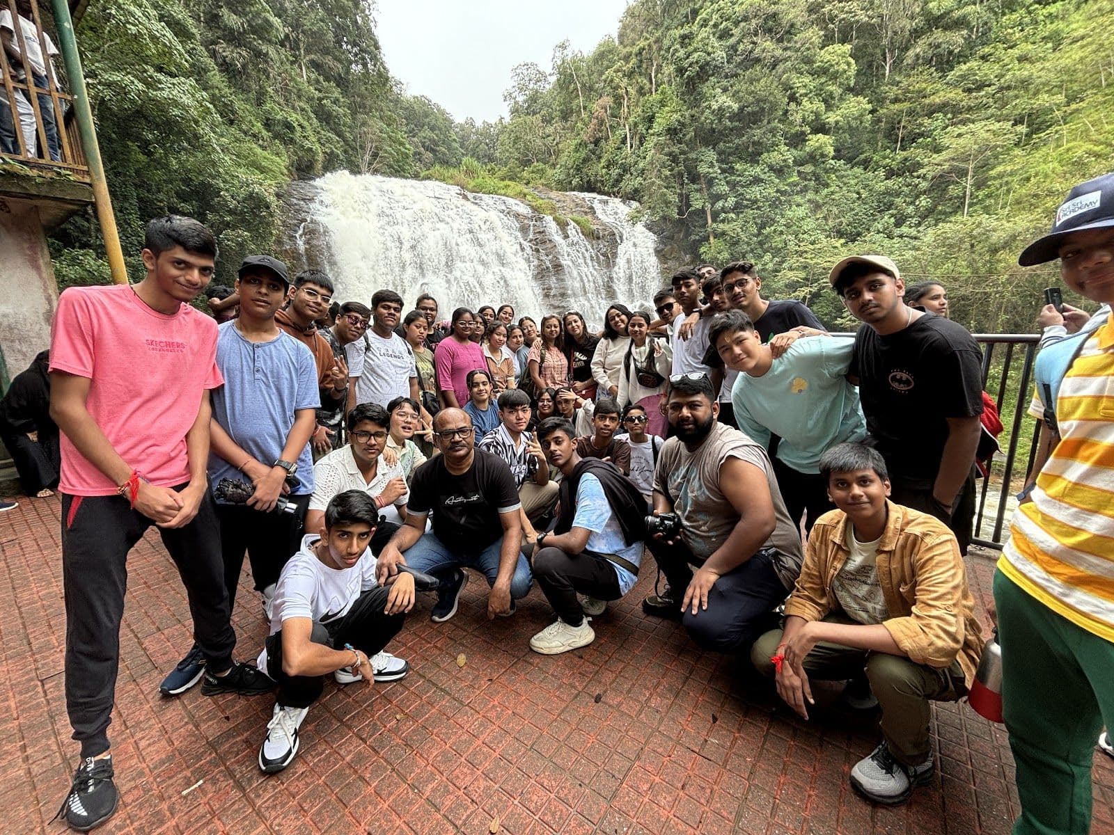 The group at a waterfall stop on a Connect-ed trip