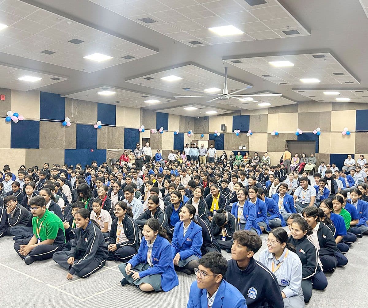 The full school seated in the auditorium for a Little Officers session