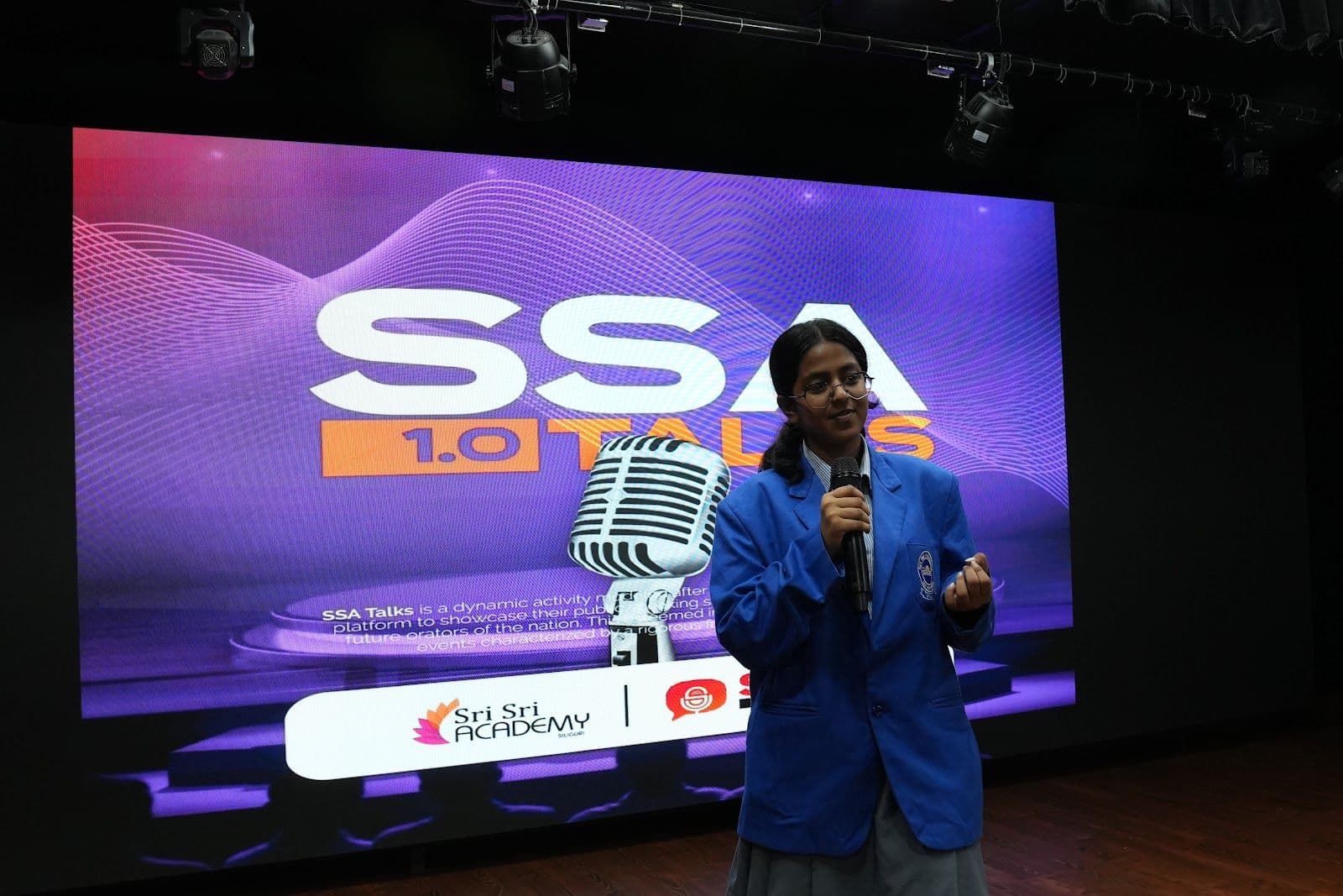 A speaker holding the SSA 1.0 Talks stage