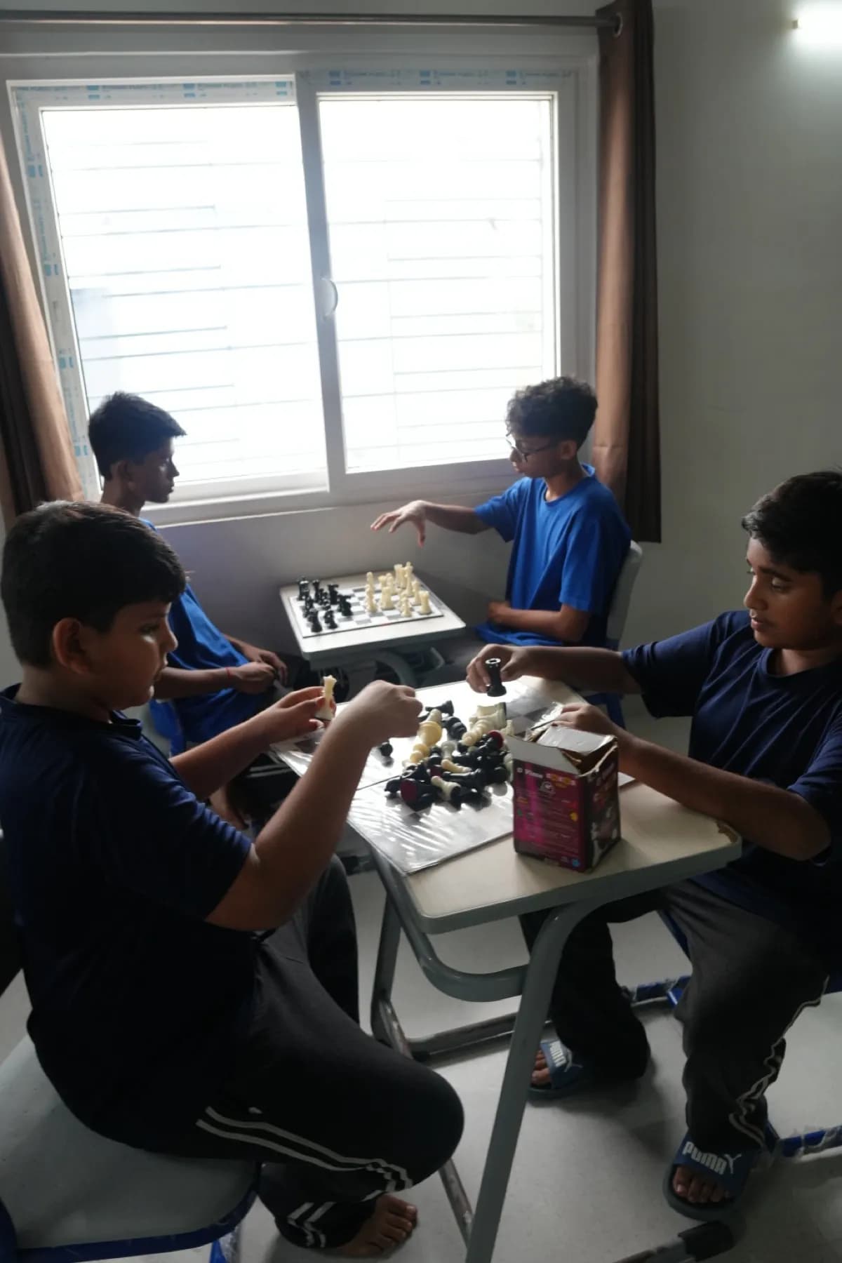 Boarders playing chess together in their wing