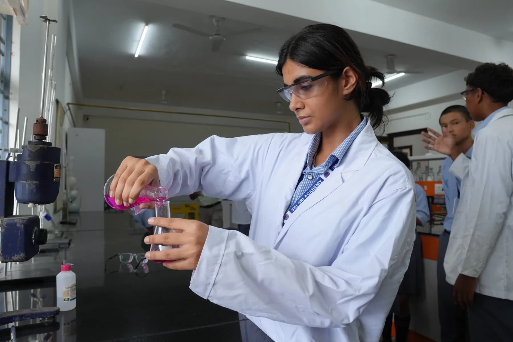 A student running an experiment in the chemistry lab
