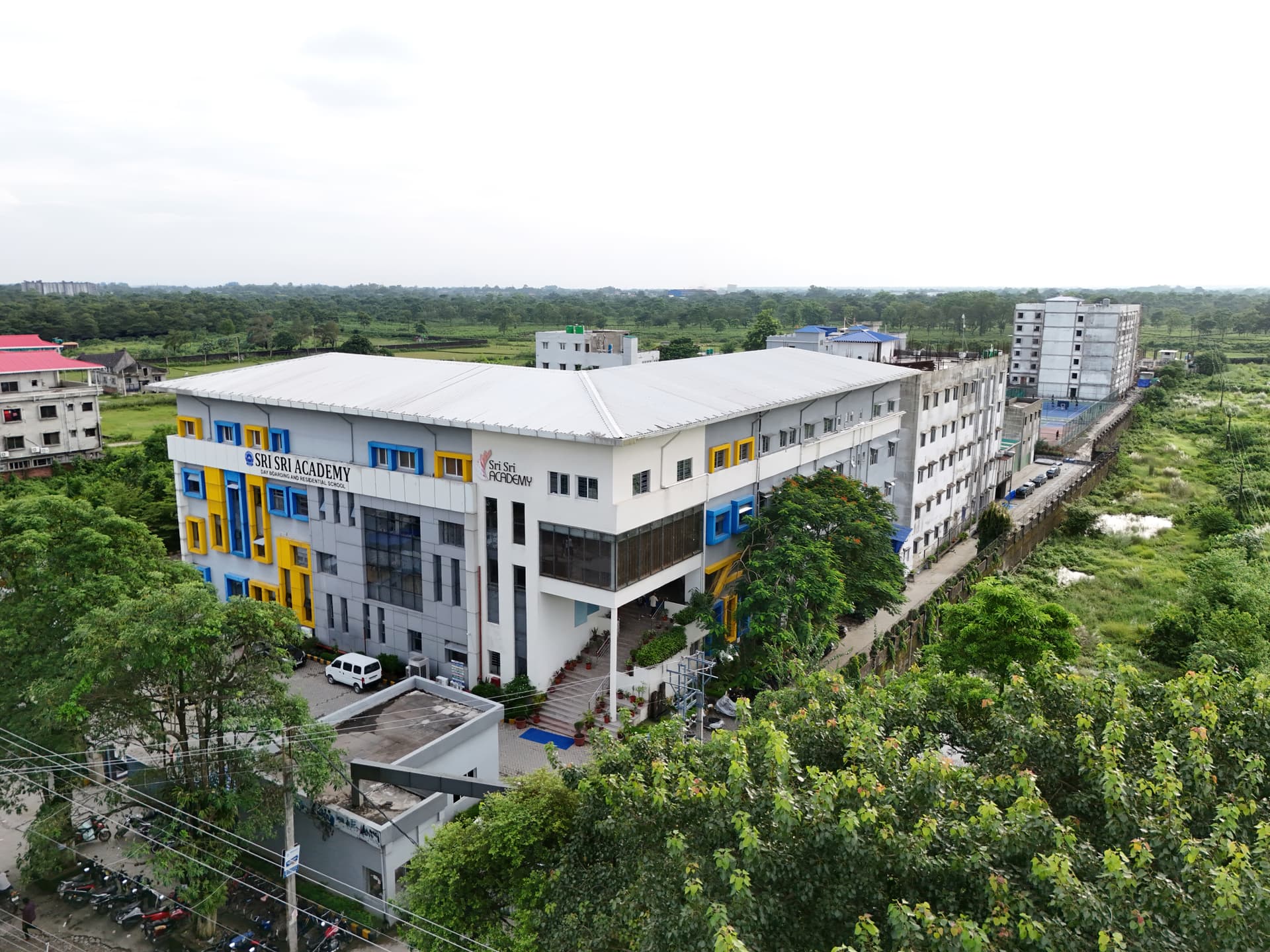 The green Sri Sri Academy campus seen from the air