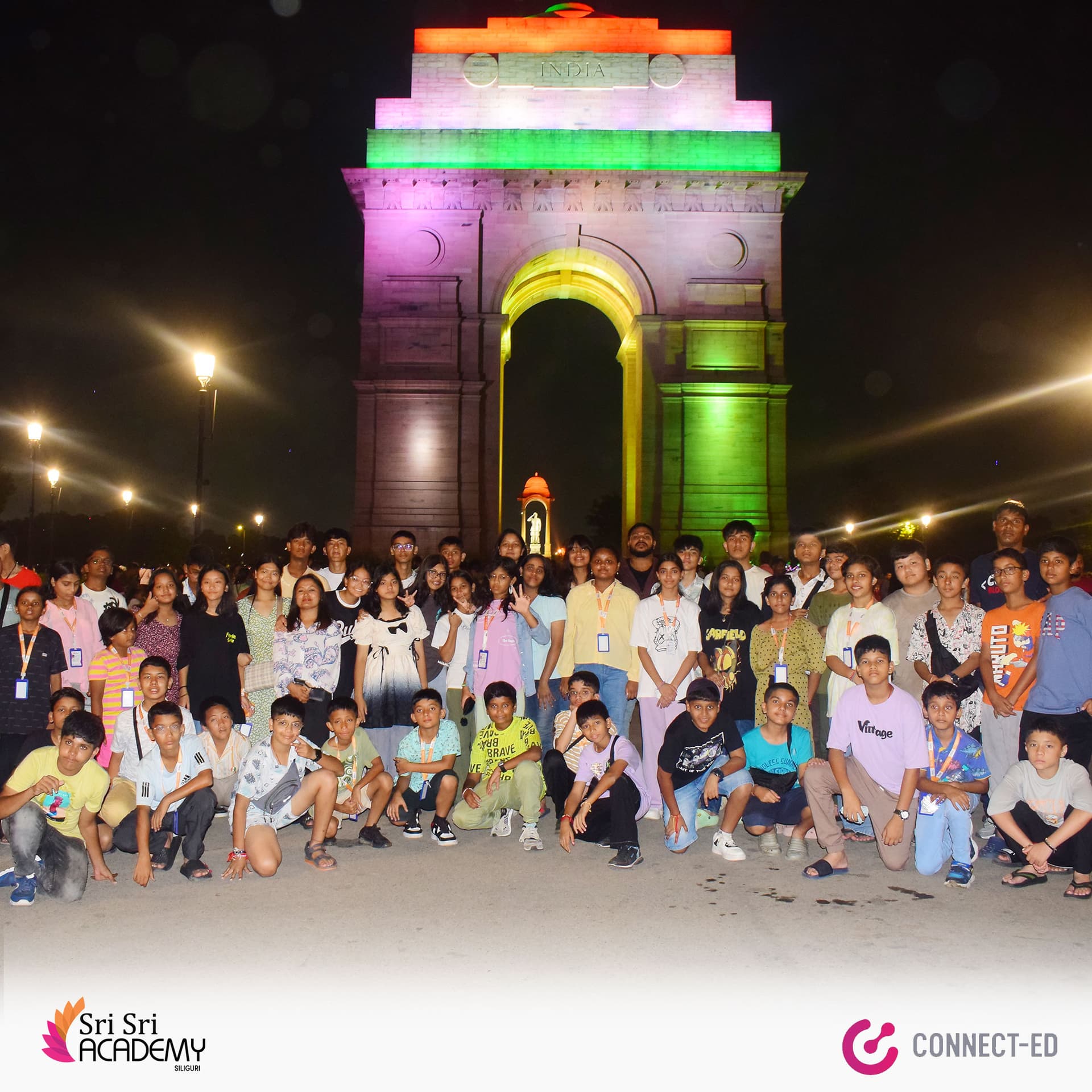 Sri Sri Academy students on an educational trip, photographed together at India Gate