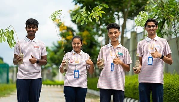 Students with plants during an environmental activity